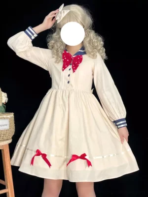 Sailor sweet lolita dress front view beige fabric navy sailor collar polka-dot bow tie striped sleeve cuffs ribbon embellishments