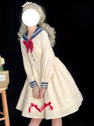 Vintage sailor sweet lolita dress beige navy collar red polka-dot bow tie ribbon skirt hem left three-quarter view