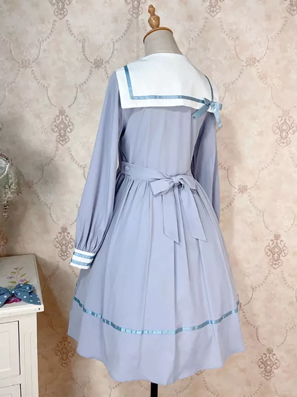 Light sky blue sailor sweet lolita dress back view white collar blue ribbon trim waist sash striped sleeve cuffs detail