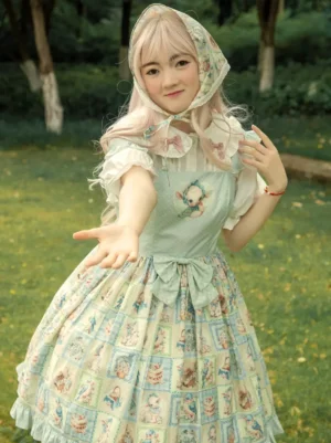 Front full-body view of light blue sheep bird cake print sweet lolita JSK dress with matching headscarf, puff sleeve blouse coordination, ruffled skirt hem, and decorative waist bow on outdoor lawn