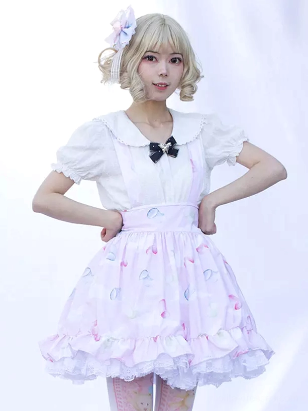 short ruffled a-line lolita skirt front three-quarter view black bow collar decoration soft pink