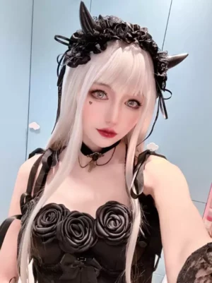 Silver long straight Gothic Lolita wig with neat bangs worn by model in horn hair accessory outfit, front half-body view