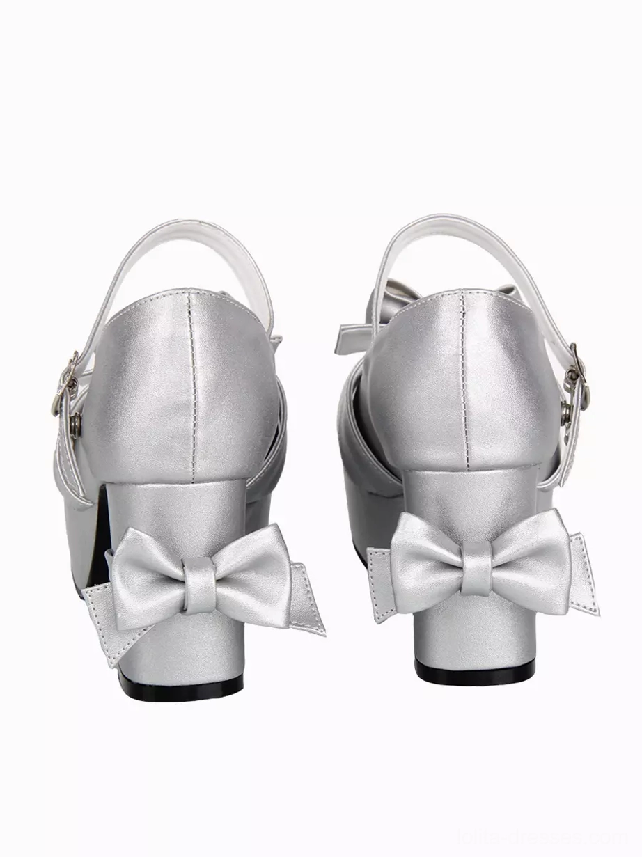 silver lolita pumps rear view displaying large decorative heel bow and metal buckle ankle strap with polished finish