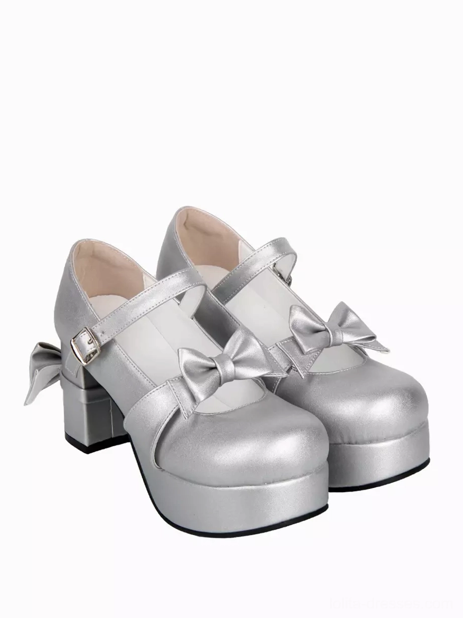 front three quarter alternate angle of silver sweet lolita pumps with dual bows showcasing matte silver pu material and ankle strap design