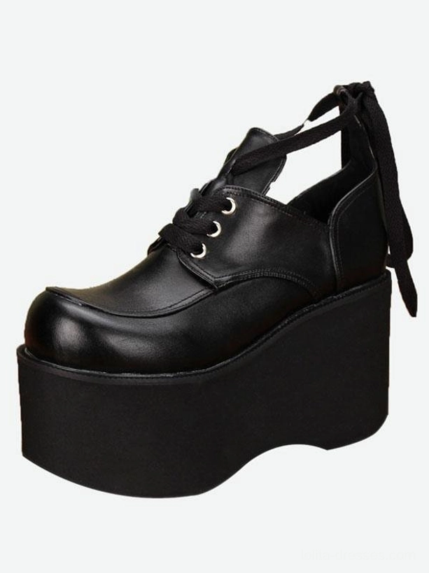 Single black gothic lolita platform shoe right oblique view smooth matte leather silver lace eyelets curved platform sole edge