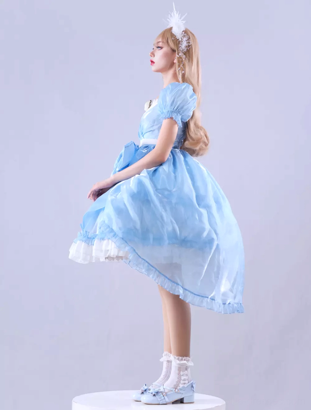 Fabric composition close-up of sky blue lolita dress showing satin and bright silk chiffon blend, texture quality, and premium material details