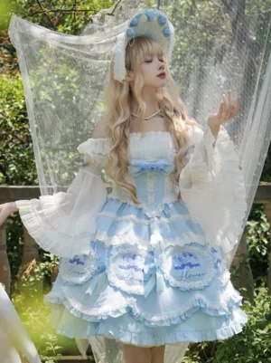 Light blue lolita dress with ruffled layers embroidered details and sheer veil prop elegant garden photography
