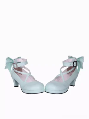 Pair of sky blue lolita stiletto high heels side profile view displaying cross instep straps and decorative back bows on pristine white background