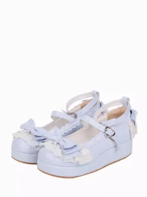 Sky blue lolita round toe pumps with heart buckle straps three-quarter side view showing bow decorations lace frills chunky heel