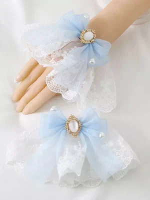 Sky blue organza wrist bow lolita bracelet with oval gem decoration and embroidered ruffled lace cuff featuring pearl accents