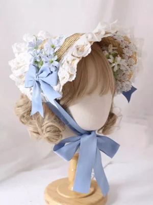Sky blue rococo lolita bonnet with ruffled white lace trim and satin bow, left side three-quarter view on mannequin with blue floral embellishments