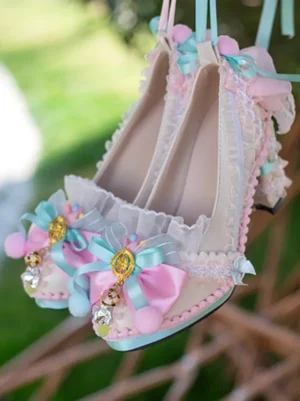 Sky blue rococo lolita high heel pump with pink and blue dual-tone bows, delicate lace ruffles, crystal pendant charms, and light blue toe trim detail