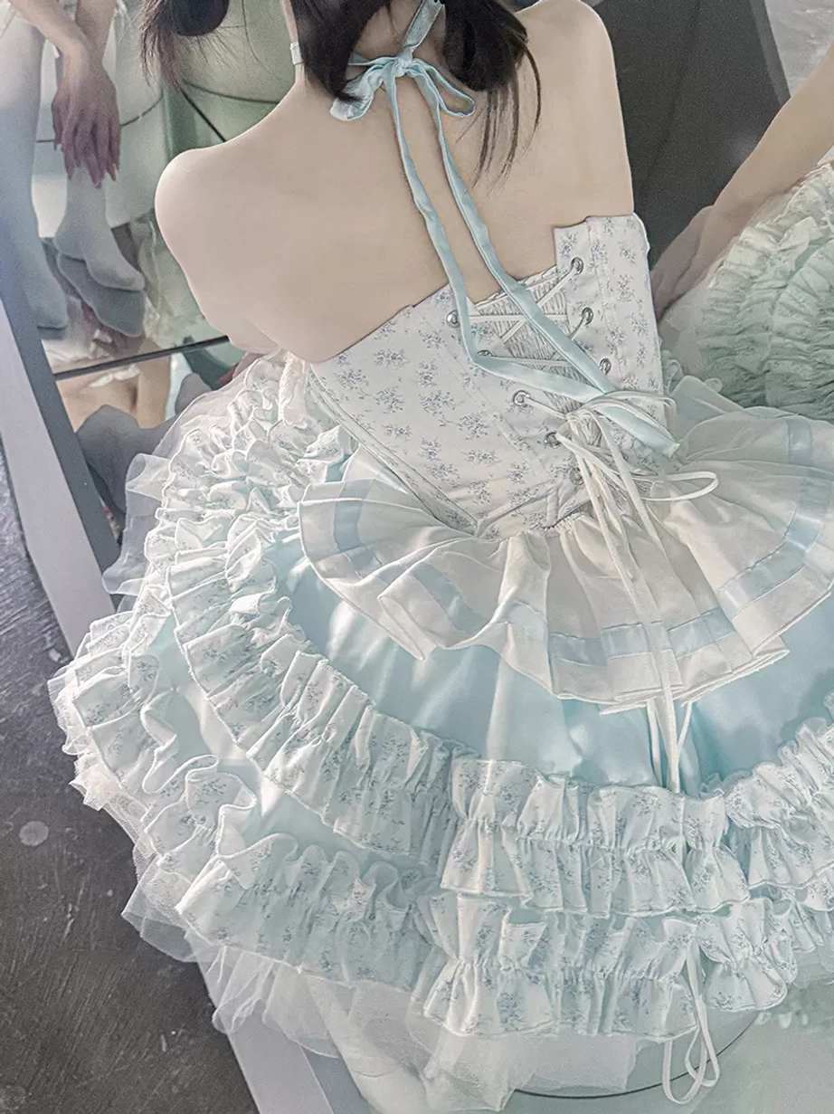Sky blue sweet lolita fairy dress complete styling on model showcasing tiered ruffled tulle skirt bows halter design romantic aesthetic