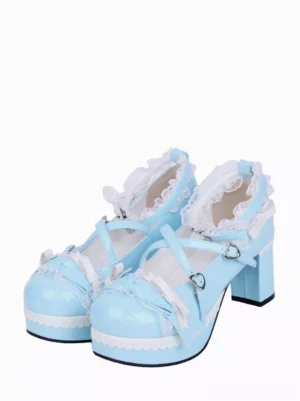 Light sky blue sweet Lolita pumps with heart-buckle cross straps, ruffled white lace trim, and bow embellishments - front three-quarter view showcasing the delicate design details and round toe silhouette