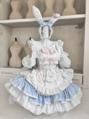 Sky blue and white rabbit maid lolita dress with tiered ruffled skirt, detachable long sleeves, and bunny ear bow headband worn on dress form, front view showing sweet lolita aesthetic