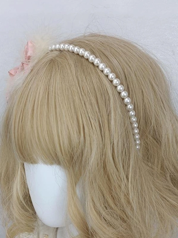 Sweet lolita pearl headband with small pink satin bow and minimal feather detail, left front angle, delicate romantic headdress