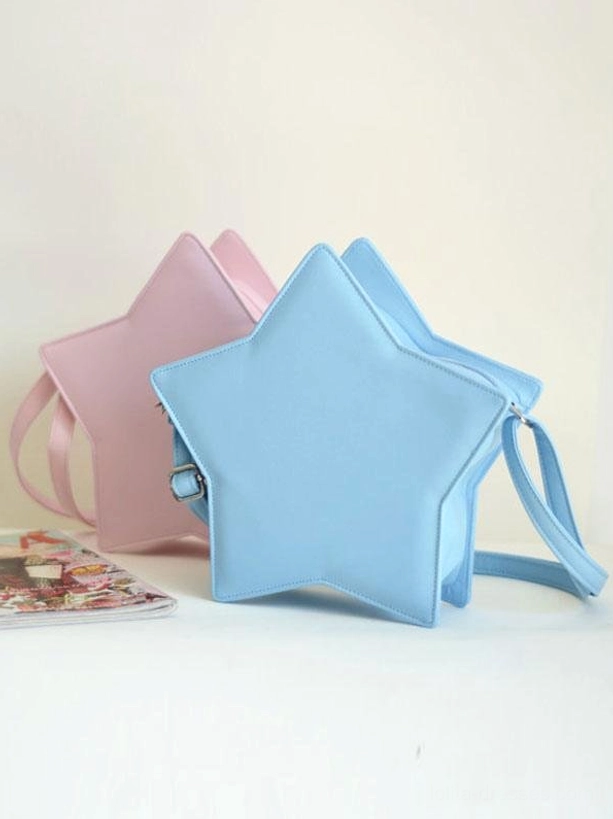Star-shaped lolita crossbody bag detail of shoulder strap attachment metal buckle hardware and leather construction showing quality and durability