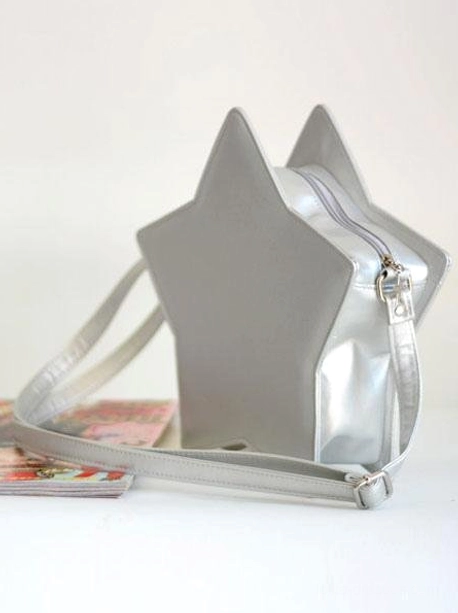 Star-shaped lolita crossbody bag detail shot showing zipper mechanism metal hardware and premium faux leather construction quality craftsmanship