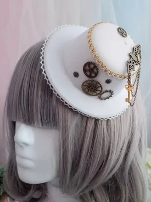 Steampunk Gothic Lolita mini top hat in white polyester with bronze gears, key and chain decorations, scalloped lace trim, front view on mannequin