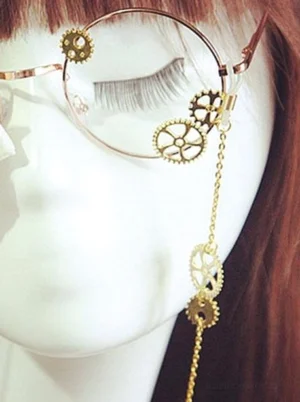 Steampunk lolita glasses featuring long gold decorative chain and gear ornaments on mannequin with brown bangs hairstyle, round metal frames close-up front angle