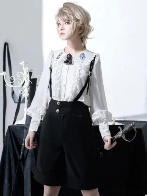 Ouji Lolita suspender shorts close-up detail shot showing embroidered ruffled collar leather suspenders metal buckles black high-waisted shorts
