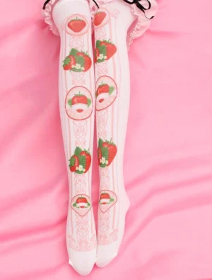Strawberry printed Lolita knee-high socks with damask pattern displayed on pink satin fabric and frilly Lolita skirt hem, overhead view showing full print design