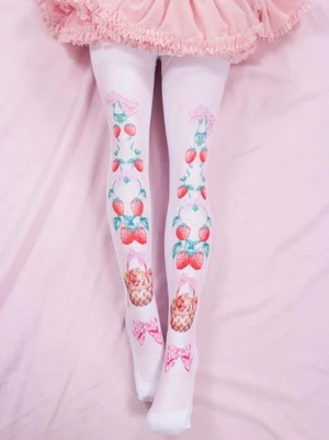 Sweet strawberry lolita tights full length view showing white base with pink strawberry basket and bow print design worn with ruffled pink skirt