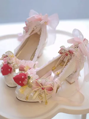 Strawberry sweet lolita chunky heel pumps ecru white with lace trim pink bows red strawberry ornaments and golden chain accents top view