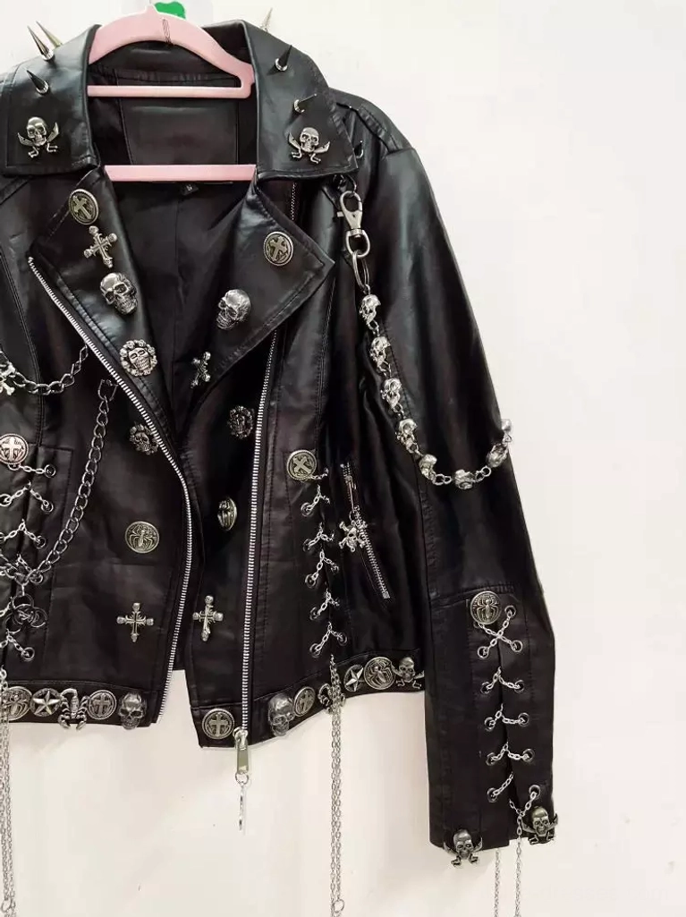 close-up-view-punk-studded-faux-leather-biker-jacket-metal-ornaments-zipper-front-chain-trim-sleeves