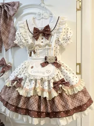 Sweet lolita OP dress with bear embroidery and plaid tiered apron in full front view hanging display, featuring polka dot puff sleeves and decorative bows