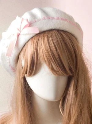 Pink ribbon bow Sweet Lolita beret variation with coordinating ric rac edge trim, displayed on mannequin three-quarter angle showing delicate pastel embellishments