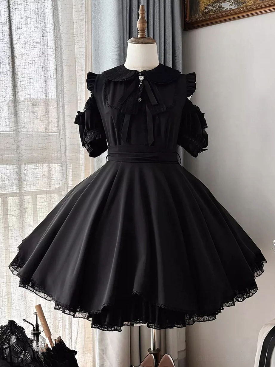 Black sweet lolita mini dress front view on dress form mannequin with peter pan collar cold-shoulder puff sleeves waist bow sash window background indoor