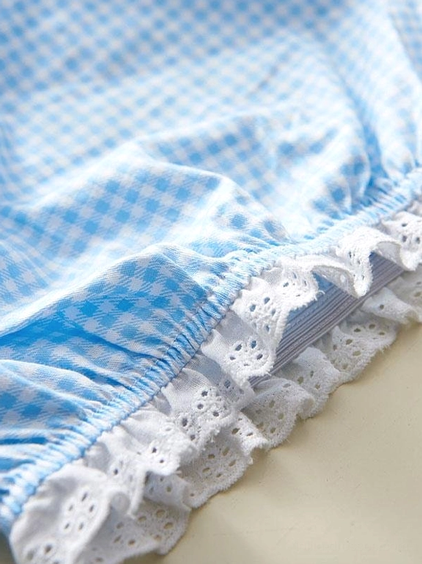 Close-up detail of sweet lolita bloomer hem showing blue white gingham fabric white eyelet lace trim elasticated ruffle edge