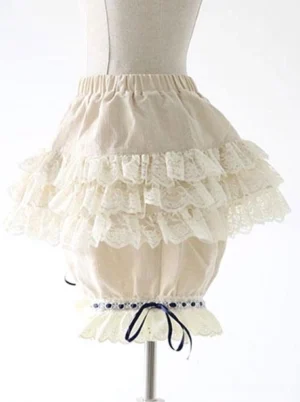 Sweet lolita bloomer shorts displayed on dress form showing front full view with elastic waistband, layered lace trim, and detailed hem accents