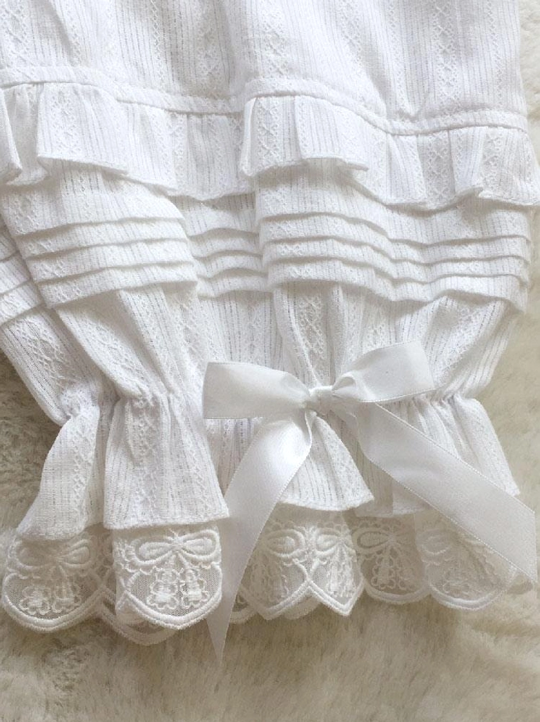 Lolita bloomer cuff detail photography featuring layered pleated ruffles, satin bow accent, scalloped embroidered lace hem, and vertical striped jacquard fabric