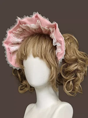 Pink sweet lolita bonnet headwear with layered lace decorations and cascading ruffle trims displayed on mannequin from side three-quarter angle with floral background