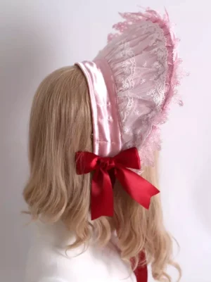 Sweet lolita pink bonnet back view showing adjustable satin head strap large red satin bow embroidered lace details