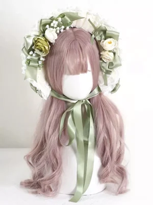 Vintage lolita bonnet with sage green satin bow and lace frill adorned with green cream artificial flowers - sweet lolita tea party hat front view