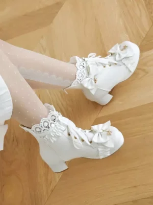 Sweet lolita boots white color top-down flat lay showing block heel lace-up closure ruffled trim