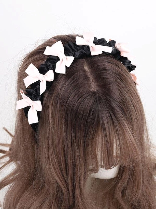 Sweet lolita bow headband rear central overhead view showing multiple pink bows placement on black satin band mannequin