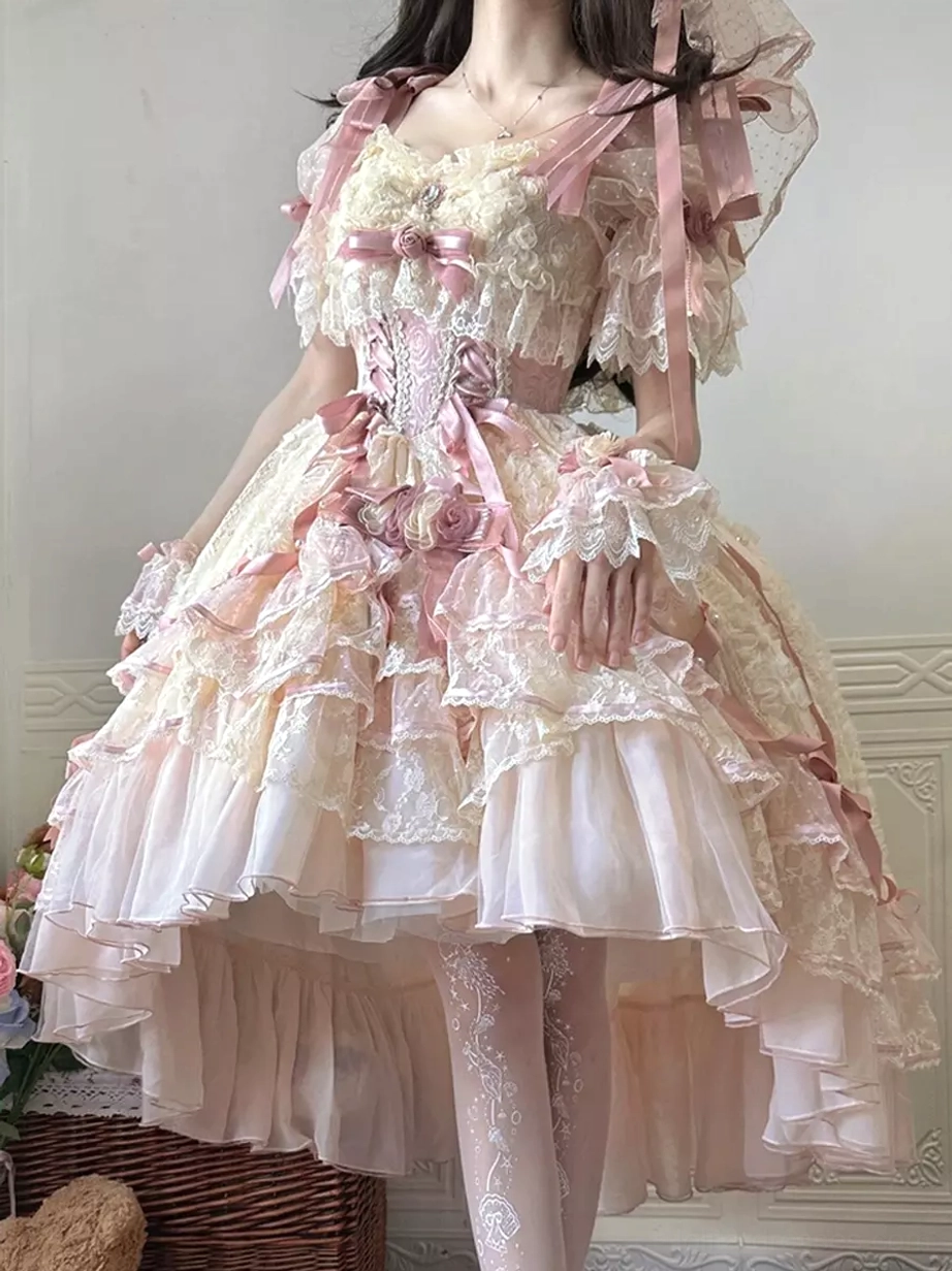 Back-side full body view of sweet lolita bridal dress showing high-low ruffled asymmetrical hemline and layered skirt with lace tights