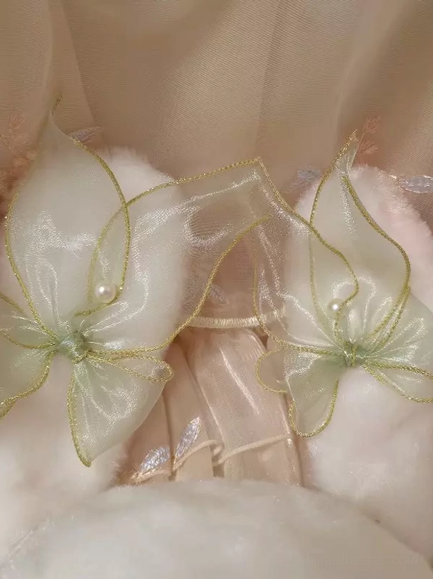 Detailed top-down close-up view of bunny bag ear showing sheer green ribbons with gold trim and small pearl decorations characteristic of sweet lolita design