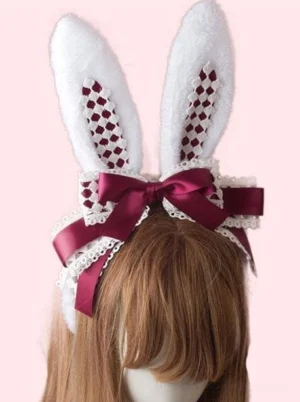 Sweet Lolita bunny ear hair clasp with wine-red grid inner fabric and satin bow on mannequin with brown wig, featuring white plush rabbit ears and white lace trim details against light pink background front view