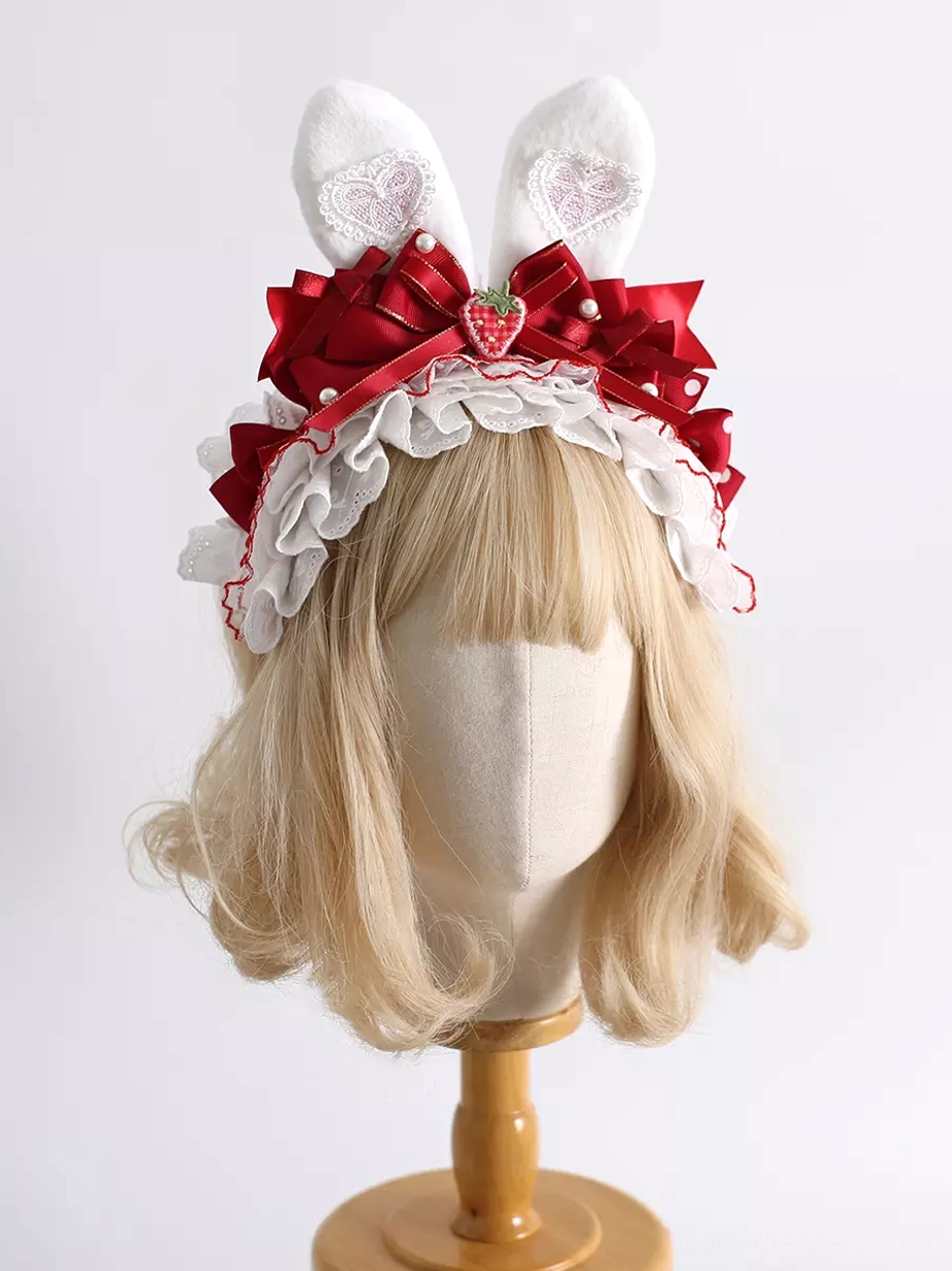 sweet-lolita-red-bunny-ear-headband-with-strawberry-accents-front-view-on-blonde-wig-mannequin-white-plush-ears-embroidered-hearts-layered-red-satin-bows-ruffled-lace-trim