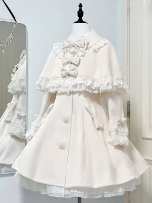 White sweet lolita cape coat with removable lace cape front flat display showing bow embellishments and ruffled details