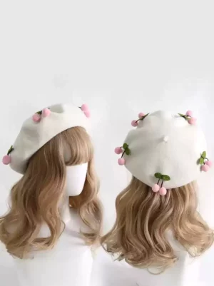 Sweet Lolita cherry beret hat with pink pom-pom ornaments, off-white polyester fabric, front and back view on blonde wavy mannequin head