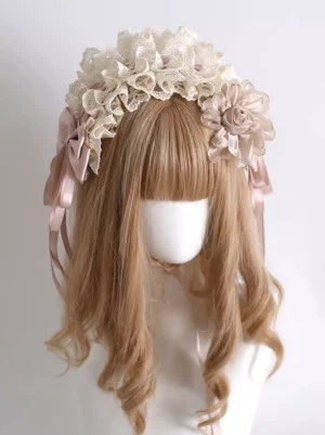 Cream Sweet Lolita floral headband front view with layered lace, dusty pink satin bows and fabric rose on mannequin with light brown curly wig