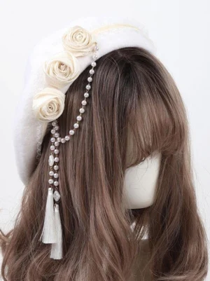 Cream white Sweet Lolita Rococo beret hat with handcrafted fabric roses and pearl tassel chain, front view on mannequin with brown hair, featuring fuzzy polyester texture and elegant floral embellishments