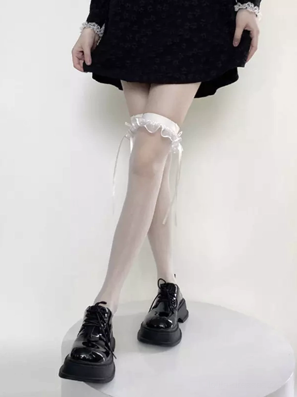 Cream colored transparent thigh high lolita stockings with ruffled garter and ribbon details front side standing angle