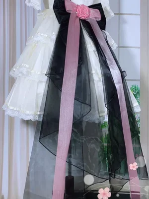 Sweet Lolita detachable train tail accessory featuring sheer black organza tail with pink satin straps and ribbon, black-pink color scheme